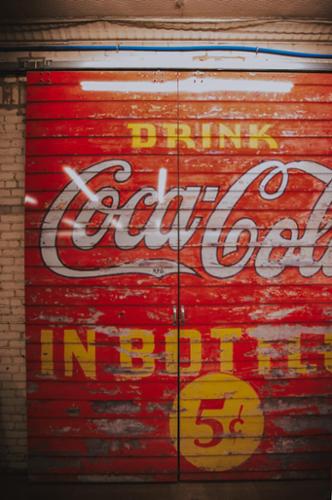 11 foot tall doors fully wrapped in vintage "Coca Cola" design.