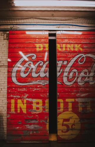 11 foot tall doors fully wrapped in vintage "Coca Cola" design.