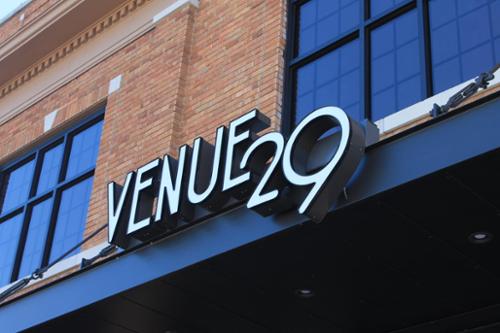 Front-lit channel letters on a raceway, mounted to awning.