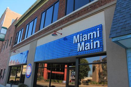 Laser cut and painted aluminum backer with mounted aluminum letters.